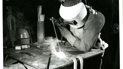A welder fusing materials.